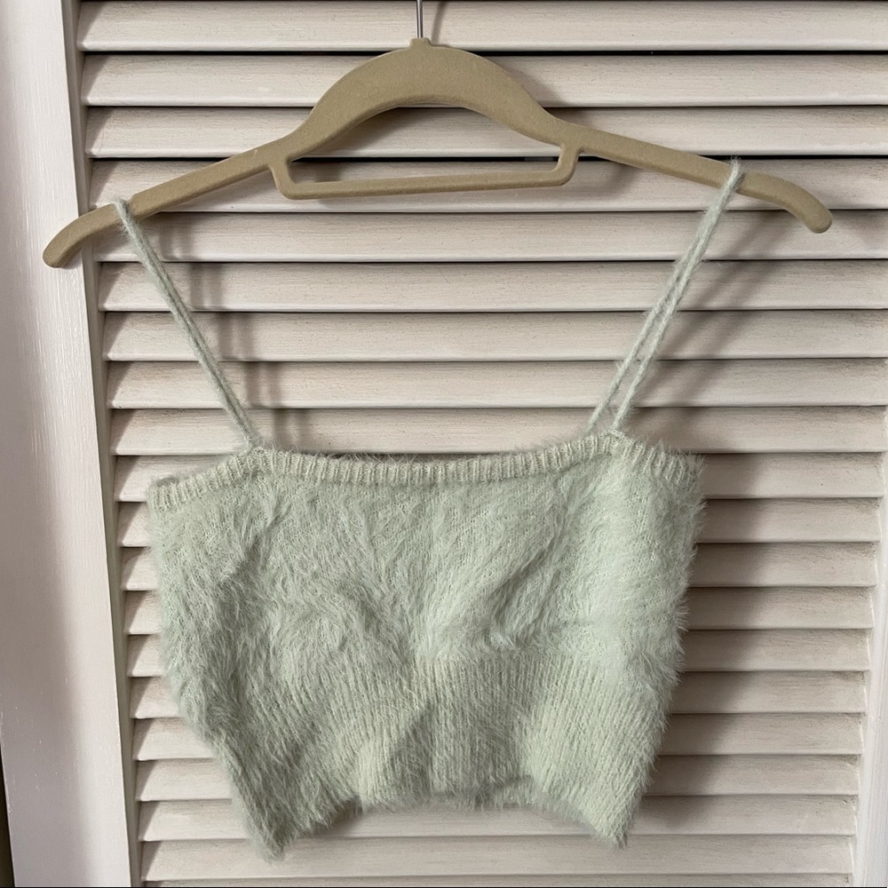 fuzzy green crop top, and fuzzy green button down sweater to match.
